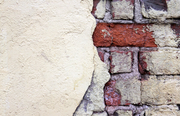 Old grunge stucco over brick wall - abstract background