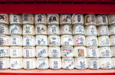 Japanese sake rice wine barrels with decorative writing clipart