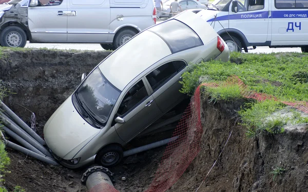 Car fell into the trench Stock Picture