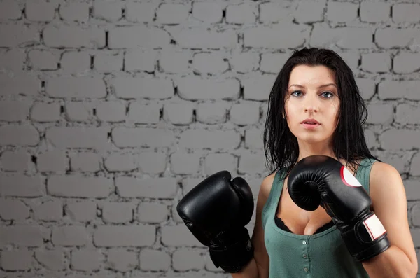 Portrait of sexy boxer girl with gloves on hands — Stock Photo, Image