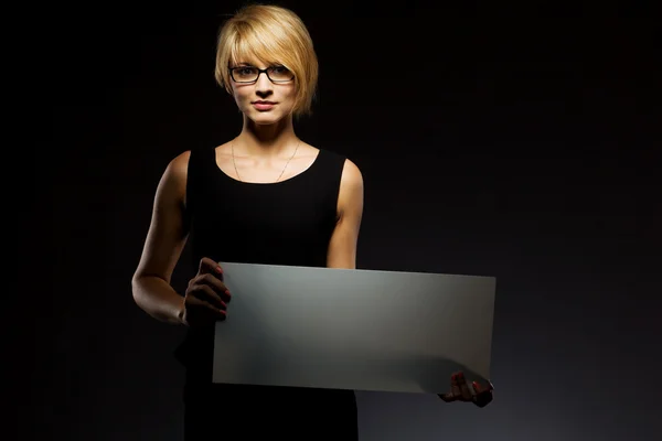 Beautiful young businesswoman with blank board. Copyspace — Stock Fotó