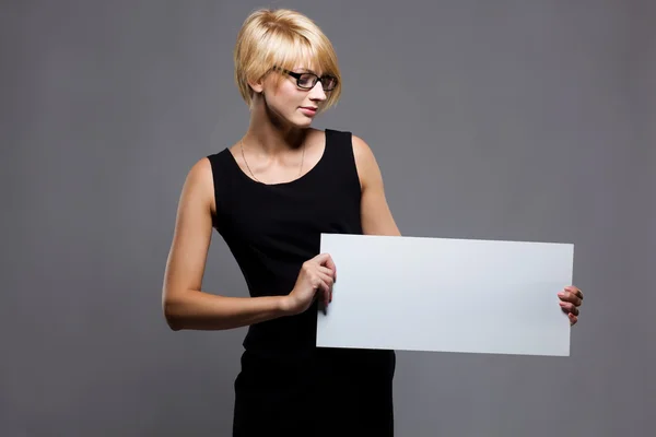 stock image Beautiful young businesswoman with blank board. Copyspace