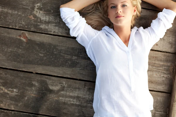 Stock image Beautiful girl relaxing near river