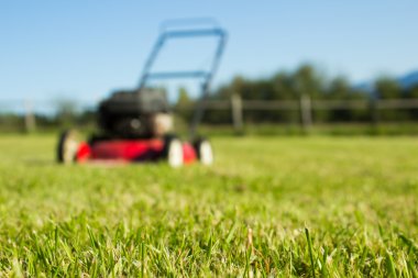 Lawn mower on grass clipart