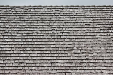 Rows of shingles on a roof clipart