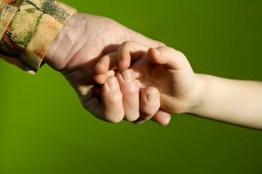 Hands of grandmother and grandchild clipart