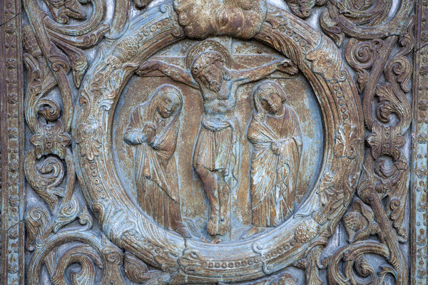 Paris - detail from main gate of Saint Denis - Jesus on the cross