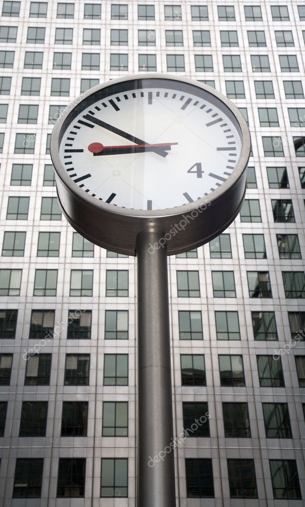 London - clock and Canary warf tower