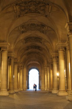 Paris - Louvre corridor and pair clipart