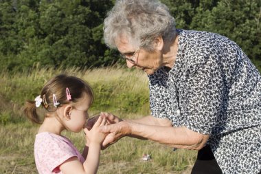 Grandmother and grandchild - drink clipart