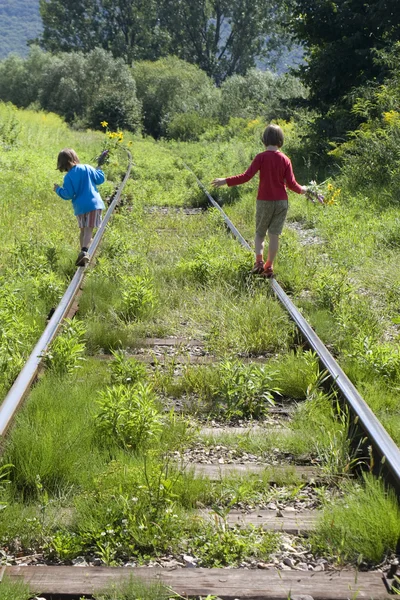 Children and old rails — Stock Photo, Image