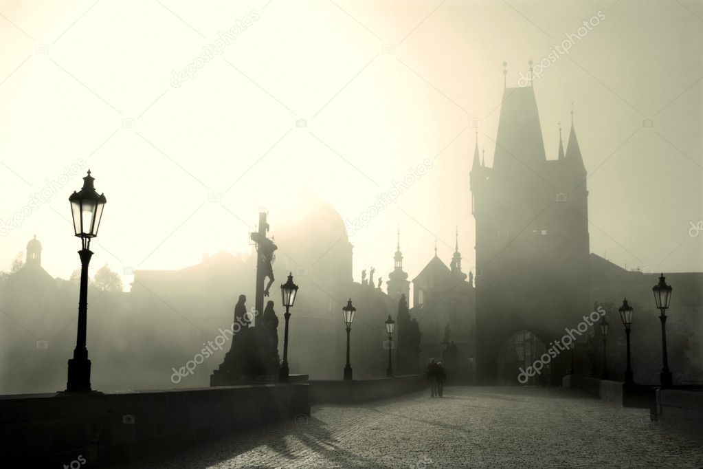 Prague - Charles bridge in morning light and fog
