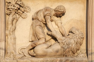 Milan - detail from facade of Duomo - Samson battle with a Lion clipart