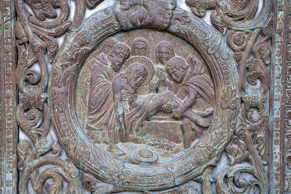 Paris - detail from main gate of Saint Denis - burial of Jesus