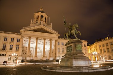 Brussels - St Jacques Church at The Coudenberg and Godefroid Van Bouillon king of Jesusalem memorial at night. clipart