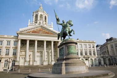 Brussels - St Jacques Church at The Coudenberg and Godefroid Van Bouillon king of Jesusalem memorial in evening. clipart