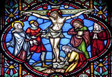 BRUSSELS - JUNE 22: Crucifixion from windowpane in st. Michael s gothic cathedral on June 22, 2012 in Brussels. clipart