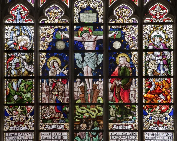 BRUSSELS - JUNE 22: Crucifixion from windowpane in gothic church Notre Dame du Sablon on June 22, 2012 in Brussels. — Stock Photo, Image