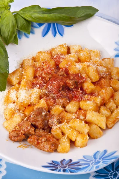 stock image Gnocchi with meat sauce, flour aproteica