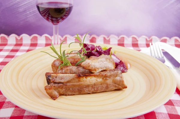 Pork chops with fried sausages — Stock Photo, Image