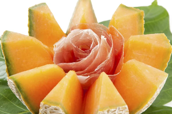 Melon with prosciutto and breadsticks — Stock Photo, Image