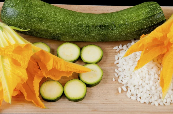 Zucchini with squash blossoms and rice — Stock Photo, Image