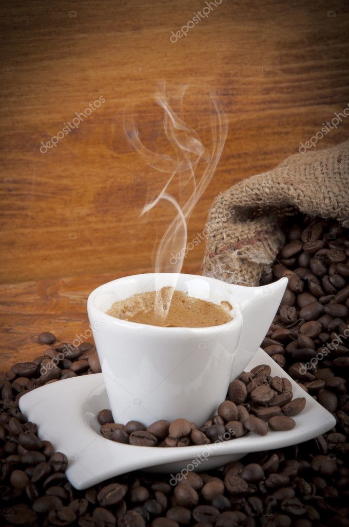 Cup of hot coffee with beans -tazzina di caffè caldo con chicch Stock Photo  by ©motorino125 11331280