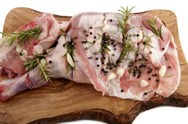 Leg of lamb seasoned with rosemary and garlic — Stock Photo, Image