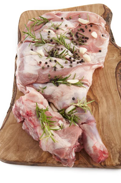 Leg of lamb seasoned with rosemary and garlic — Stock Photo, Image