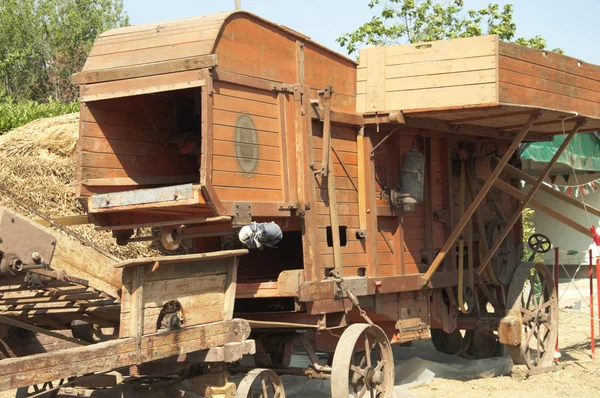 stock image Ancient machine for threshing wheat 60 years