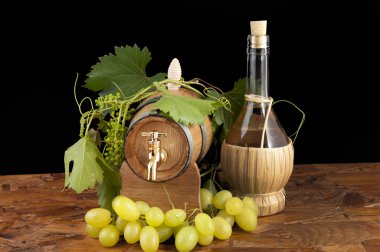 In oak casks with vines and grapes white and black clipart