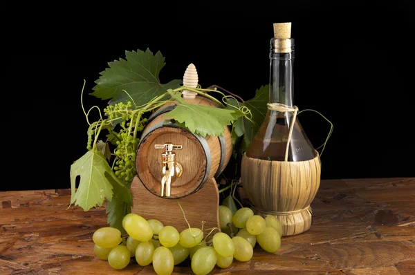 stock image In oak casks with vines and grapes white and black