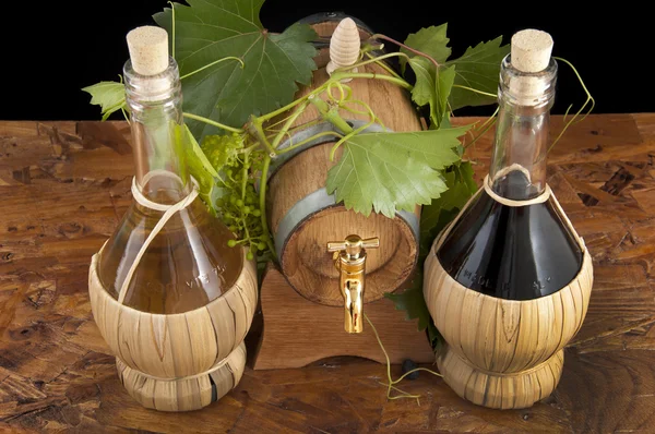 stock image In oak casks with vines and grapes white and black