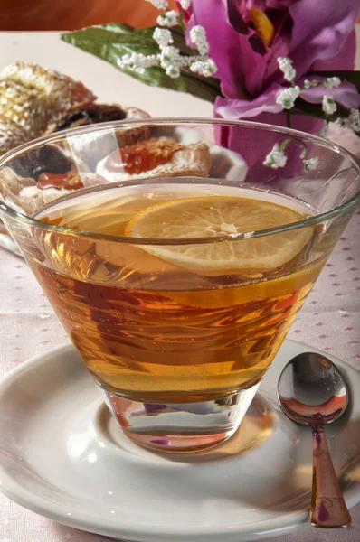 Tea with lemon croissant — Stock Photo, Image