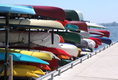 Colorful kayaks for Rent clipart