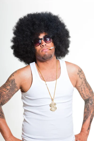 Hip hop urban black man retro afro hair wearing white shirt and bling bling isolated on white. Smoking cigarette. Looking confident. Cool guy. Studio shot. — Stock Photo, Image