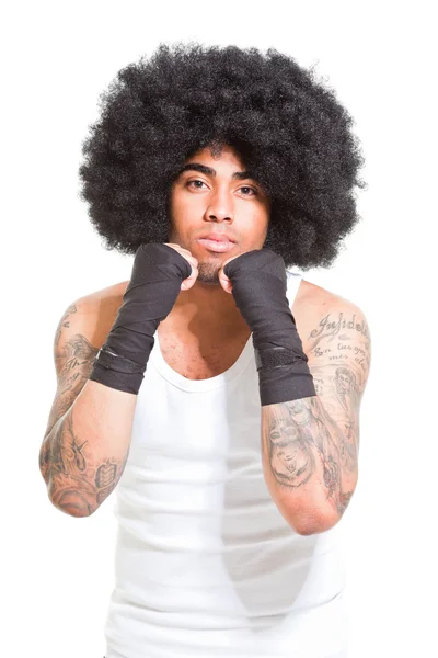 Young male retro boxer isolated on white background. Wearing white shirt and black shorts. Training outfit. Wet skin from sweating. Tattoos on his arms. — Stock Photo, Image