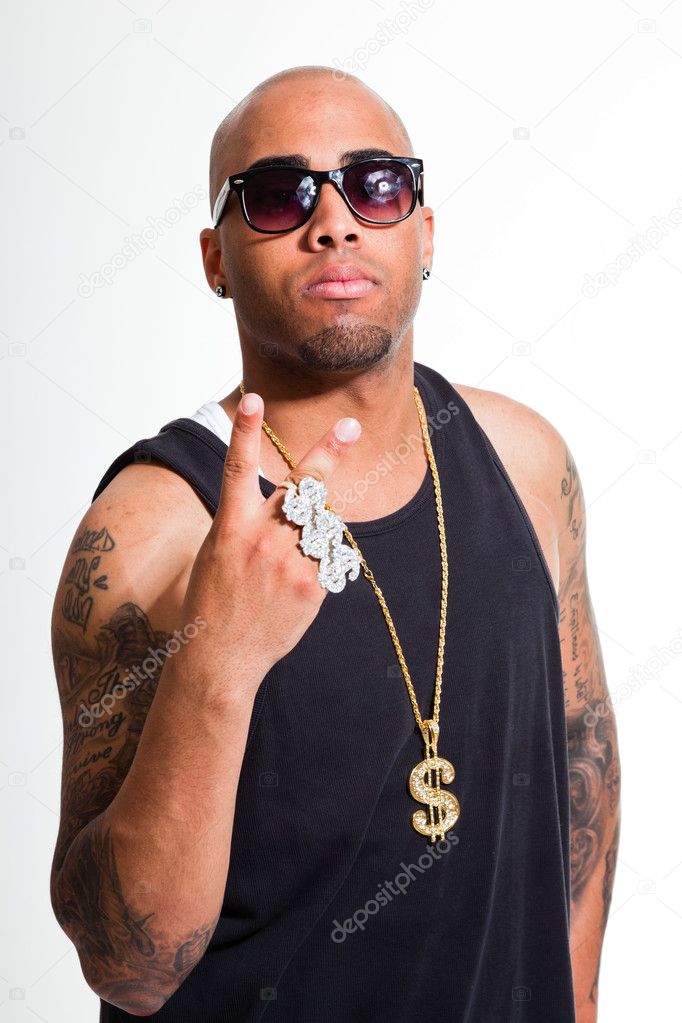 Hip hop urban gangster black man wearing dark shirt and bling bling isolated on white. Looking confident. Cool guy. Studio shot.