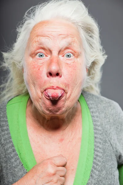 stock image Senior woman white grey hair with expressive emotional face and hands. Studio shot isolated on grey background.