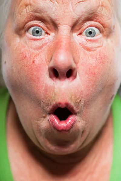 Closeup expressive face of senior woman. Studio shot. — Stock Photo, Image
