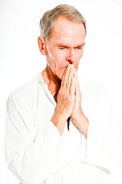 Expressive good looking senior man casual summer dressed against white wall. Spiritual and characteristic. Isolated. Studio shot. — Stock Photo, Image