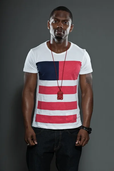 Cool urban stylish black american man. Fashion studio portrait isolated on grey background. — Stock Photo, Image