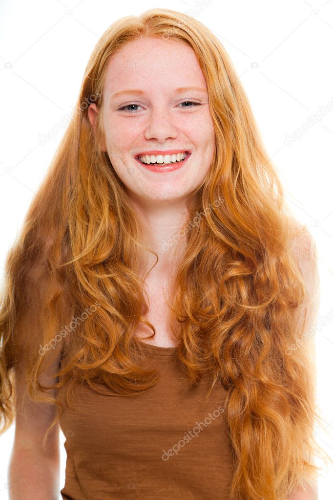 Happy smiling pretty girl with long red hair wearing brown shirt. Fashion studio shot isolated on white background.