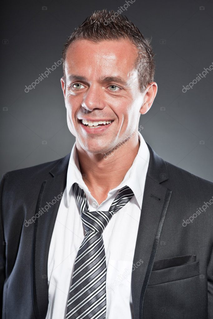 Good looking business man blue eyes and short blond hair. Tough guy