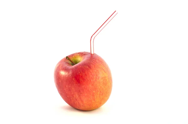 Trubka v sladké červené jablko na bílém pozadí — Stock fotografie