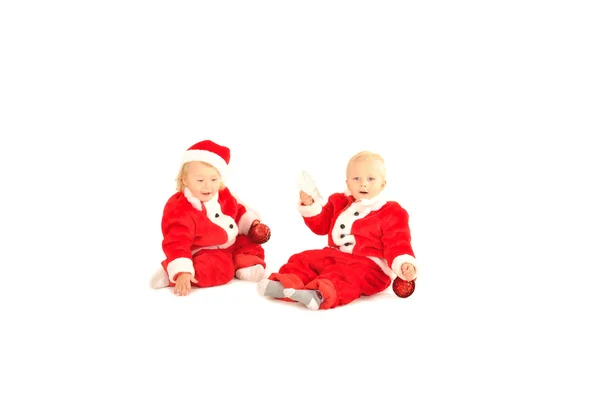 Dwoje dzieci fanny w santa ilość strojów na białym tle — Zdjęcie stockowe