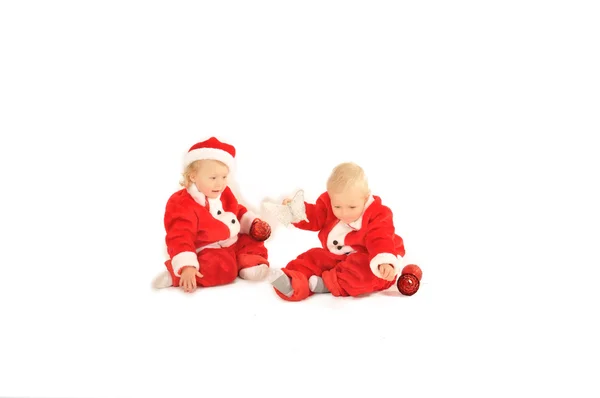 Two fanny kids in santa clauss costumes isolated on white — Stock Photo, Image
