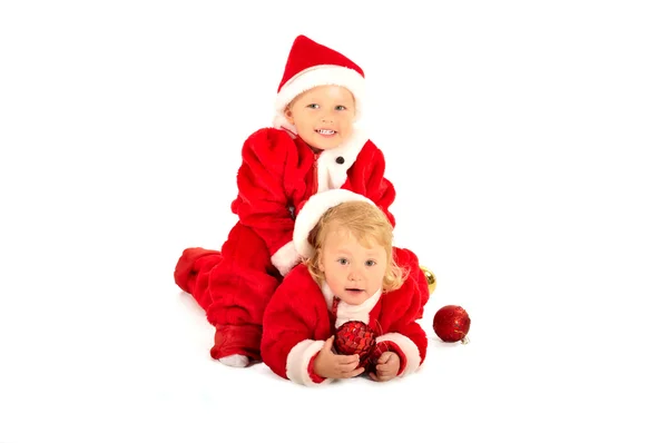 Two fanny kids in santa clauss costumes isolated on white — Stock Photo, Image