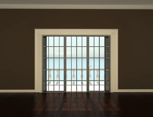 Leerer Innenraum mit beigen Wänden und Fenstern zur Terrasse lizenzfreie Stockfotos