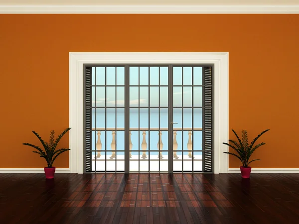 Leere Innenräume mit orangefarbenen Wänden, Blumen und Fenstern zur Terrasse Stockfoto